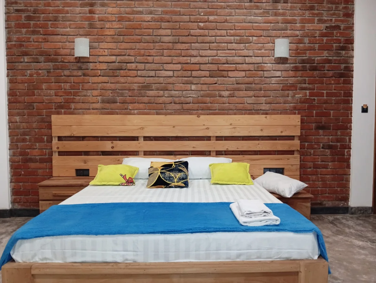 Double room with exposed brick feature wall